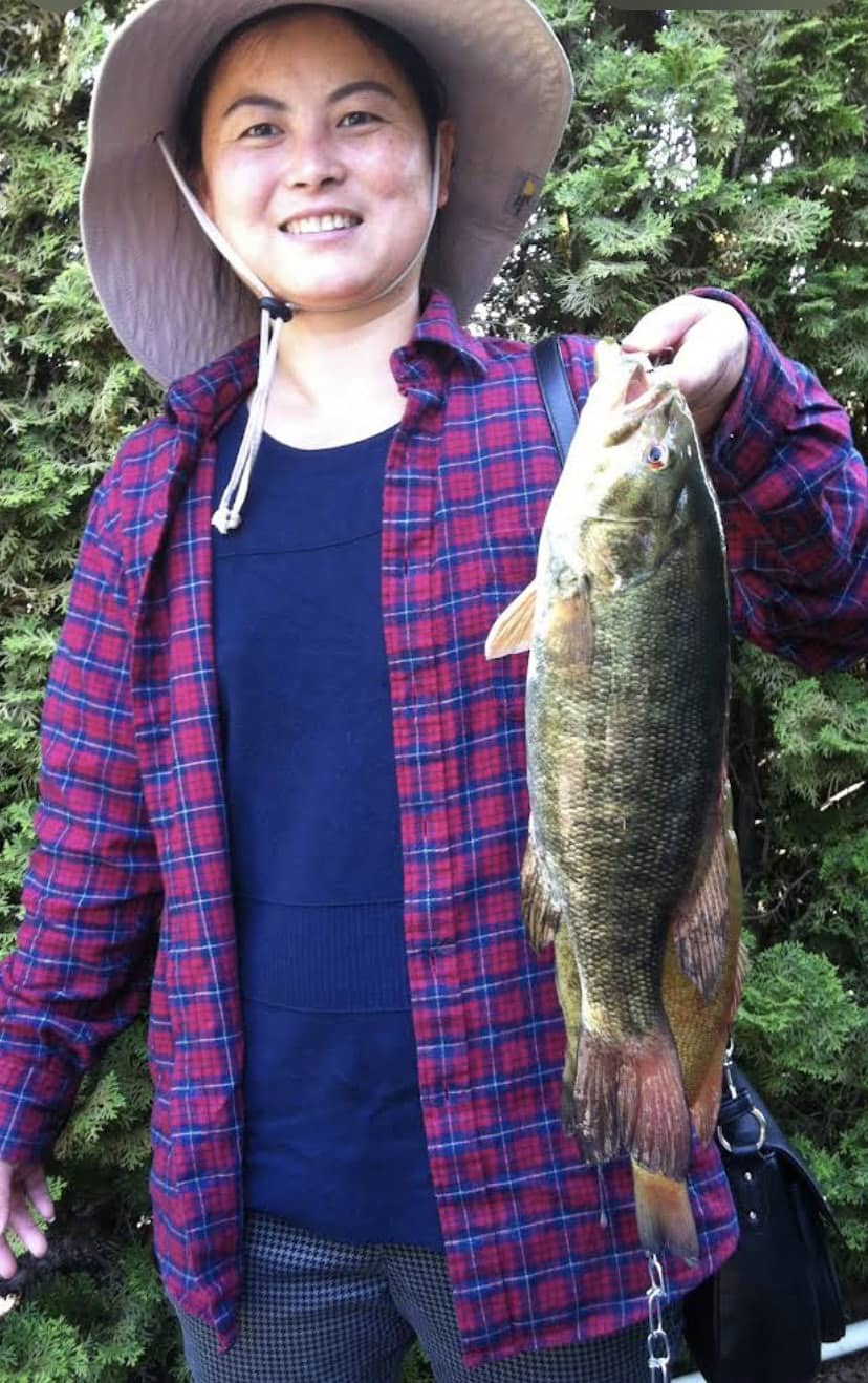 A photo of Sami holding a fish she caught